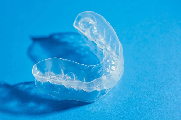 Individual teeth tray for whitening on blue background — Stock Photo, Image