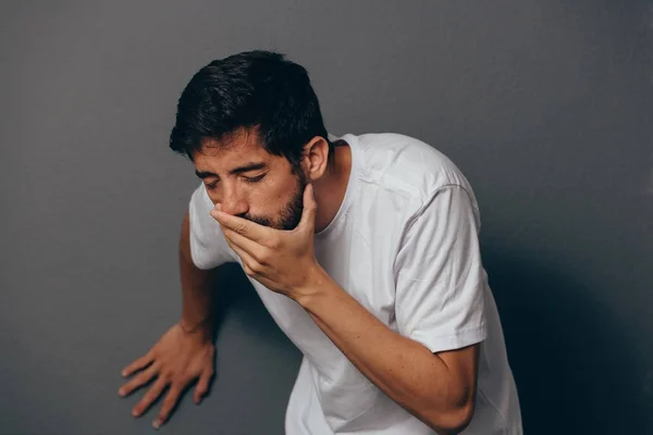Portrait of young man drunk or sick vomiting — Stock Photo, Image