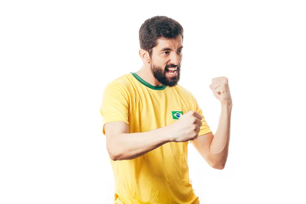 Бразильский футболист празднует на белом фоне — стоковое фото