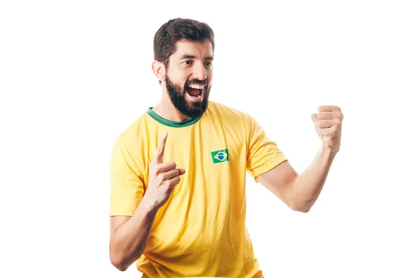 Braziliaanse voetballer viert op witte achtergrond — Stockfoto