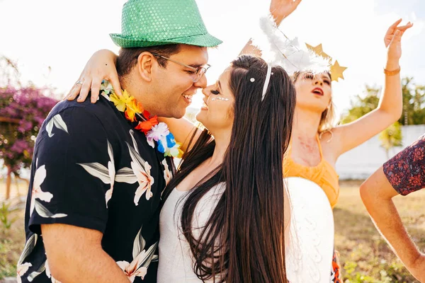 Brazilian Carnival. Couple in costume enjoying the carnival party in the city