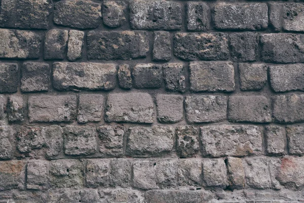 Nahaufnahme Einer Schwarzen Gealterten Ziegelmauer Als Hintergrund — Stockfoto