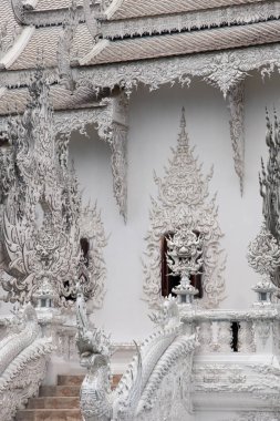 beautiful thai temple decorated with sculpture flames clipart