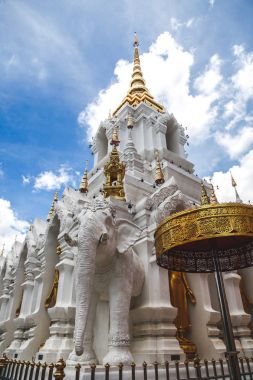 beautiful thai temple decorated with sculptures an gold clipart