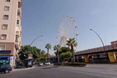 view of spanish street with ferris wheel clipart