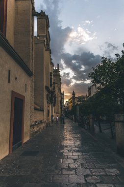 street view at evening time under beautiful cloudy sky, spain clipart