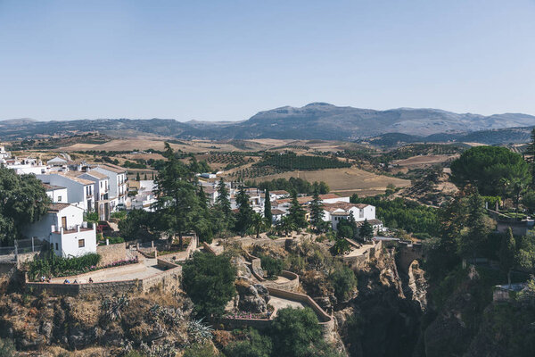 scenic view of spanish landscape with hills, mountains and buildings