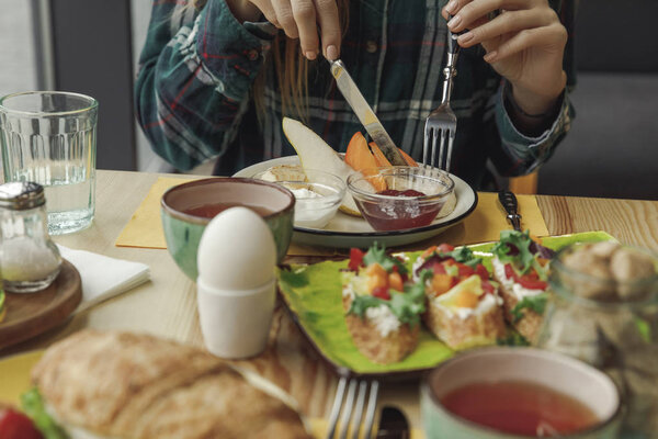 partial view of person eating healthy tasty breakfast 