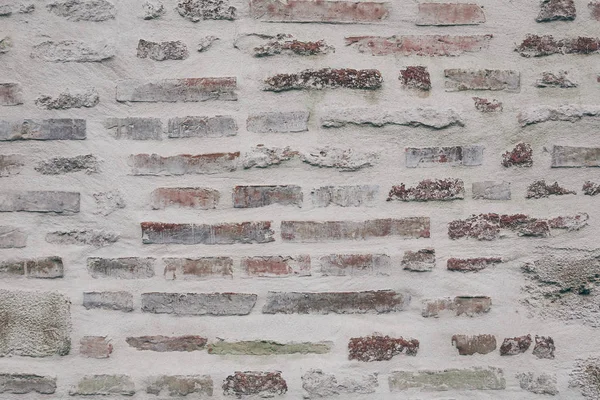 Close-up shot of ancient brick wall for background — Stock Photo