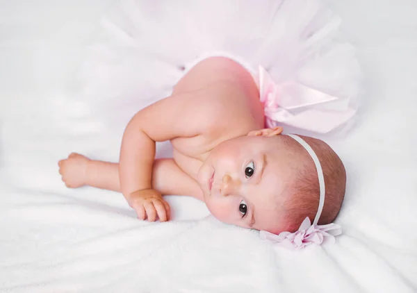 Sweet little baby wearing ping tutu skirt — Stock Photo, Image