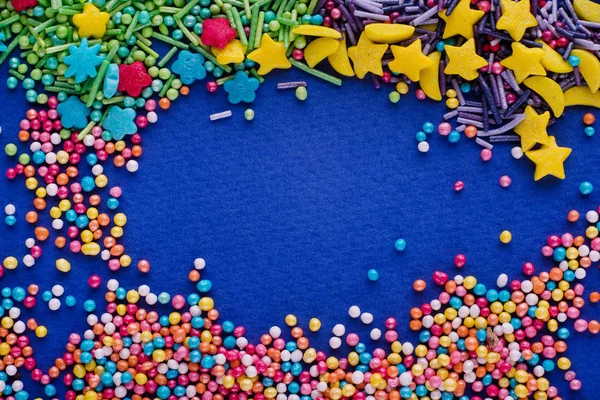 Sugar sprinkle dots, colored decoration for cake and bekery, a lot of sprinkles as a background