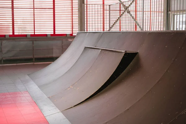 Skate track. Close up of a metallic ramp in a skate park.