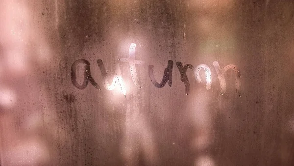 Autumn rain, the inscription on the sweaty glass - autumn — Stock Photo, Image