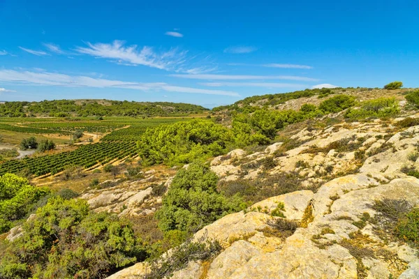 View of the beautiful countryside in the region around the small French town of Gruissan with its hills, rocks and vines in the south of France — Stock Photo, Image