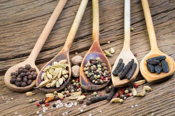 Closeup Five Wooden Cooking Spoons Various Exotic Spices Rustic Wood — Stock Photo, Image