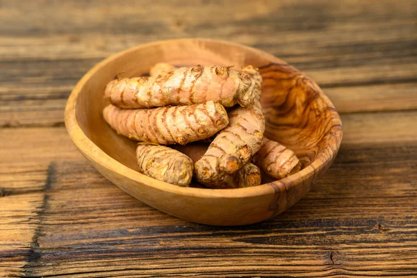 Fresh Whole Turmeric Roots Wooden Bowl Front Wooden Rustic Background — Stock Photo, Image