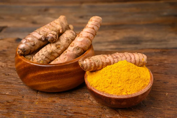 Wooden Bowl Curcuma Powder Wooden Bowl Whole Turmeric Roots Front 스톡 이미지