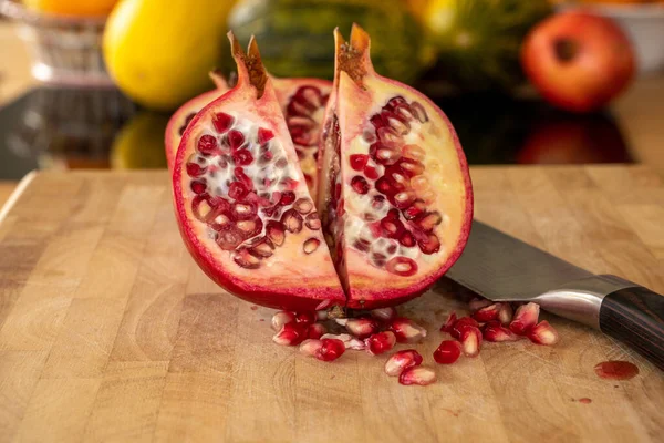 Close Two Half Pomegranates Fruits Damascus Kitchen Knife Wooden Cutting — Stock Photo, Image