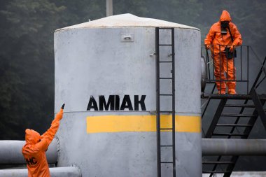 Rescuers measure the level of ammonia in the air during exercises in the educational center of the State Emergency Service of Ukraine in Sumy region, Ukraine clipart