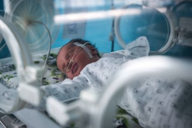 A premature baby in an incubator in intensive care unit in the maternity hospital in Kramatorsk, Donetsk region, Ukraine clipart