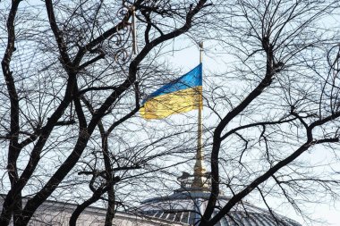 Ukrainian flag on the parliament building in Kiev, Ukraine clipart