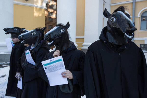 KIEV, UKRAINE - March 5, 2018: Protest action of anti-corruption organizations during the judges' congress in Kiev, Ukraine. Horse heads symbolize corrupt candidates in the judiciary.