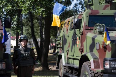 Soldiers of the National Guard of Ukraine and Ukrainian armored personnel carriers 