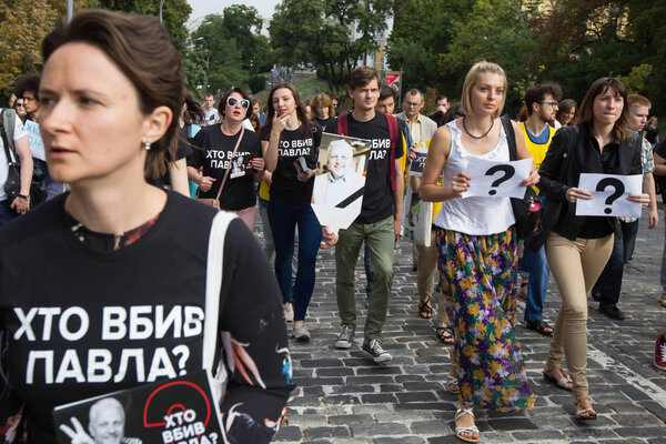 People attend the rally demanding to find and punish those responsible for the murder of Belarusian journalist Pavel Sheremet in Kyiv, Ukraine. July 20, 2017.