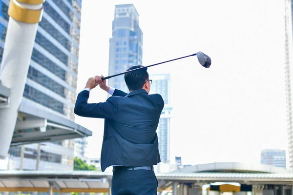 Concept Business people playing sports, Businessmen play golf to