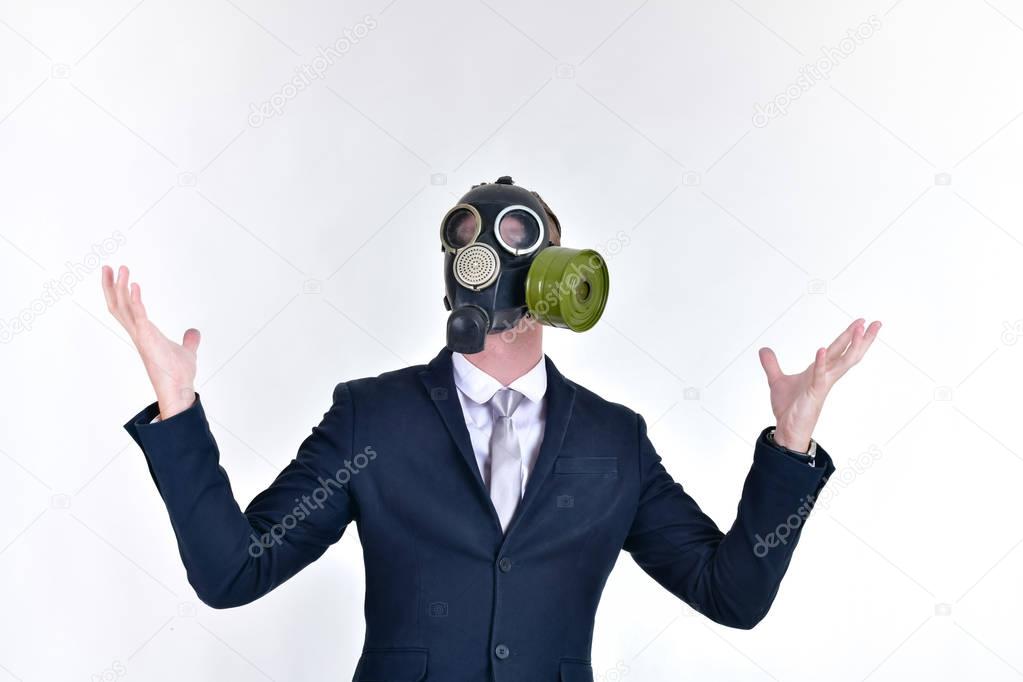 Business Concepts. Businessman wearing a gas mask on a white bac