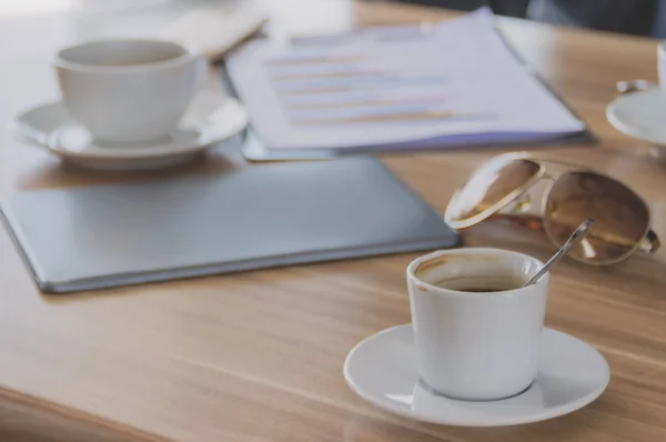 Coffee is placed on a table with business meetings.
