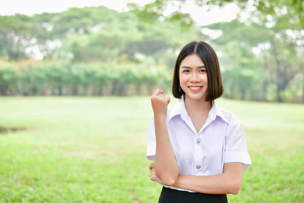 Education Concepts. Beautiful young Asian girl is thinking serio