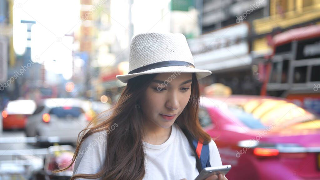 Travel concept. Beautiful girl searching for information on mobile phones. 4k Resolution.
