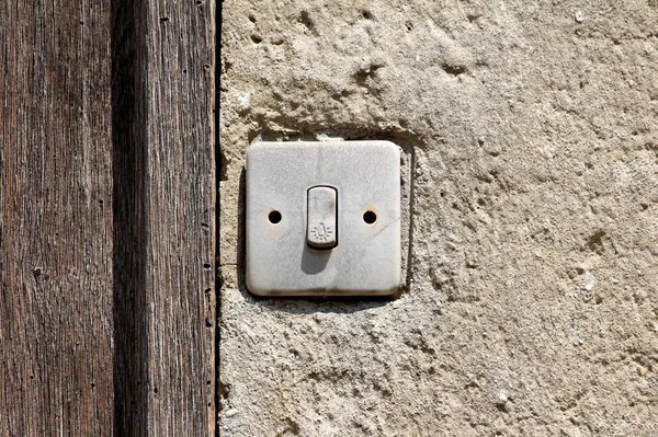 Dirty Grey Old Small Broken Light Switch Next Wooden Doors — Stock Photo, Image
