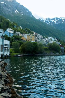 buildings on riverside in Norway clipart