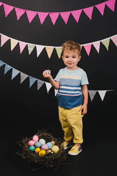 Kid and easter eggs — Free Stock Photo