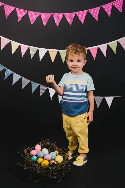 Kid and easter eggs — Stock Photo