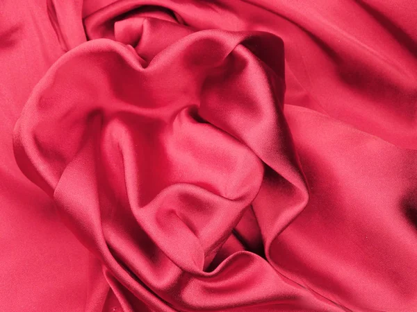 Material de cetim vermelho com conceito de amor de forma de coração — Fotografia de Stock