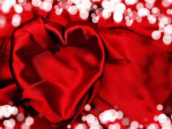 Rød satin materiale med hjerte form kærlighed koncept - Stock-foto