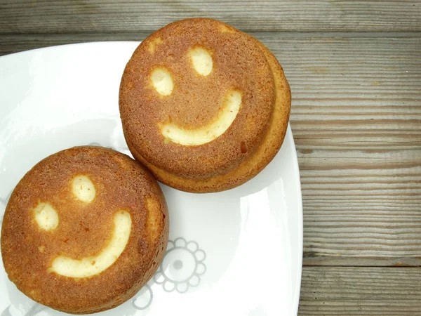 Creative food cakes with funny smile face form — Stock Photo, Image