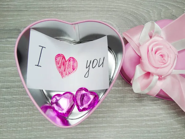 Valentine's day composition of greeting card in gift box and hea — Stock Photo, Image