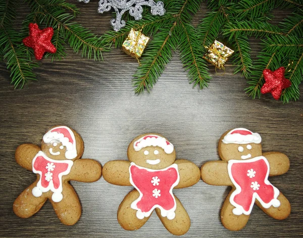 christmas cookies gingerbread and decoration on wooden backgroun