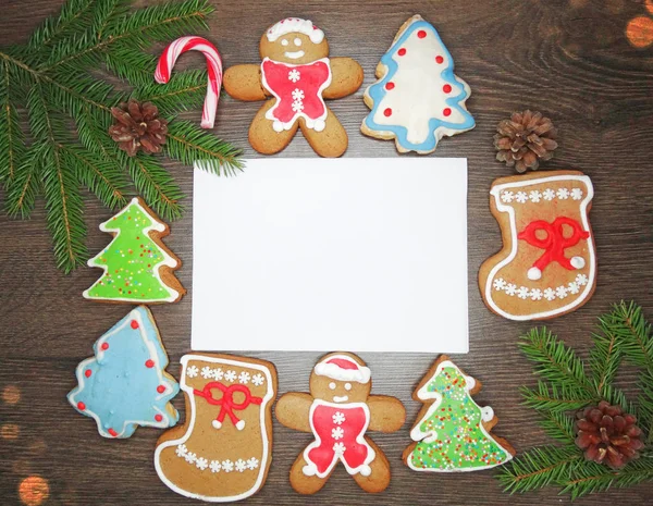Soubory cookie vánoční přání a dekorace na dřevěné backgro — Stock fotografie