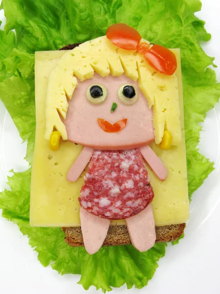 creative food sandwich with sausage and cheese served on lettuce