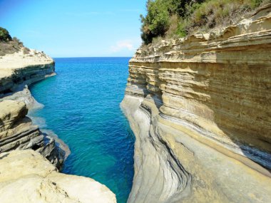 sidari famous beach landscape ionian sea on Corfu island  clipart