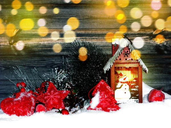 christmas lantern decoration winter berries and snow on wooden b