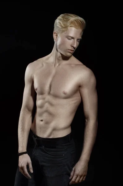 Blond man with naked torso posing on black background — Stock Photo, Image