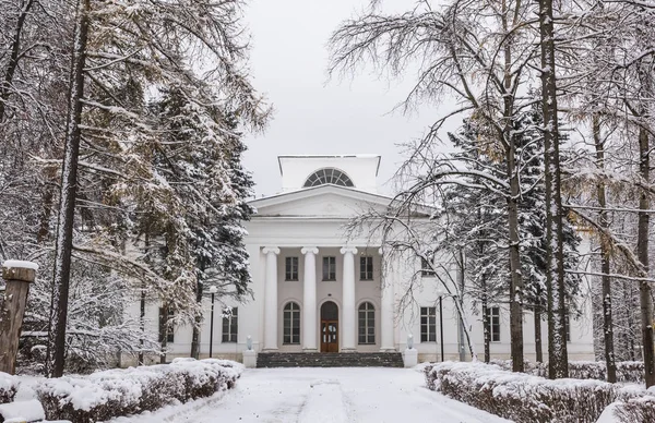 The main manor house of count Olsufyev (now a public building) in the  Ershovo village, Moscow region, Russia. Ancient lindens manor park. Winter view.