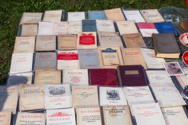 Moscow, Russia - May 1, 2018: flea market street goods. antiquarian editions of communist books. The speeches of Stalin, Voroshilov, Malenkov, Budyonny, Mikoyan, Ordzhonikidze and other revolutionaries and Bolsheviks clipart