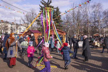 Vladimir, Russia - March 1, 2020: Shrovetide celebration. Kids are playing.
